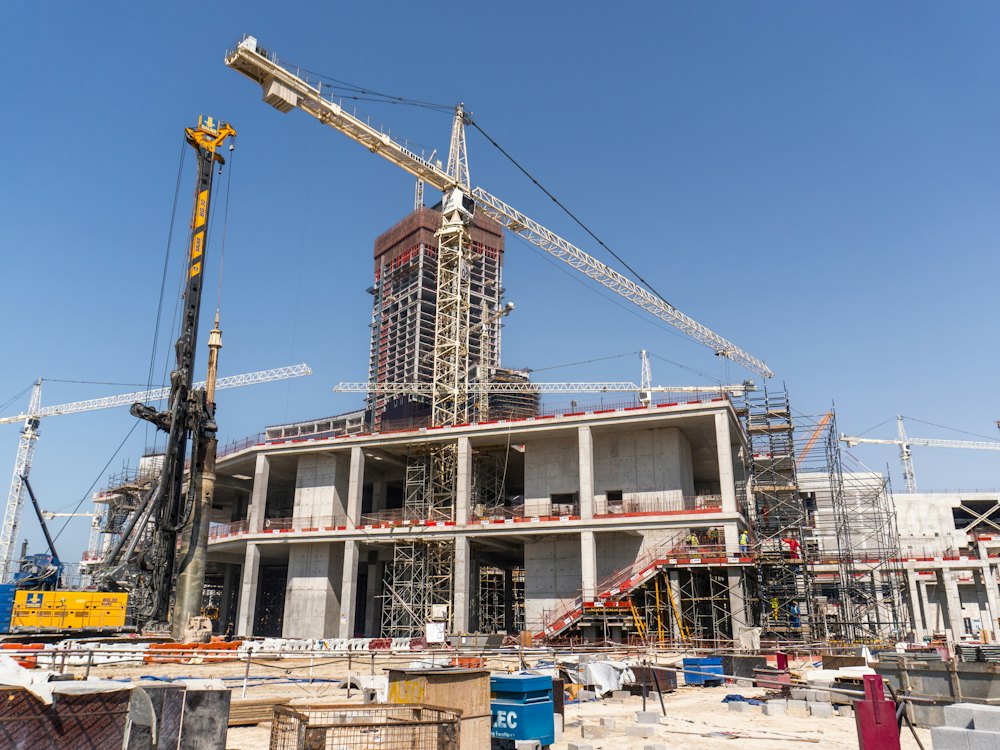 Concrete frame and tower cranes on a building site
